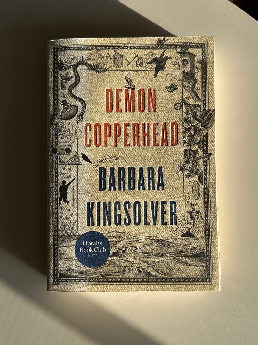 Demon Copperhead by Barbara Kingsolver - Cream Cover with Red & Blue Text